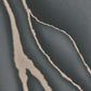 Elle Decoration Patterned Stone Wallpaper in Black