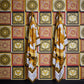 Baroque Squares Textured Wallpaper in Red/Gold from the Versace V Collection