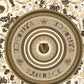 Baroque Circle Textured Wallpaper in Black/Cream by Versace Home
