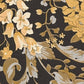 Baroque Damask Textured Wallpaper in Black/Gold from the Versace V Collection