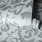 Fiore Operatic Flowers Wallpaper in Poppy Seed