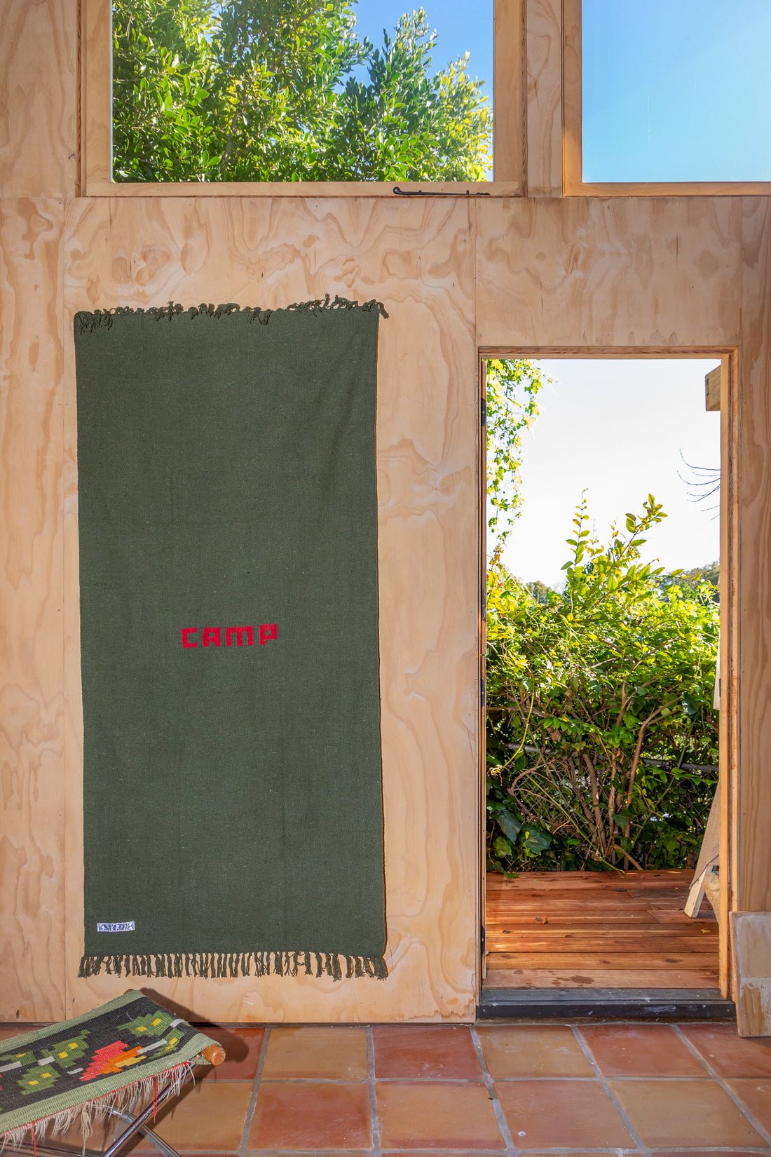 Puebco Camp Rug hung on wall